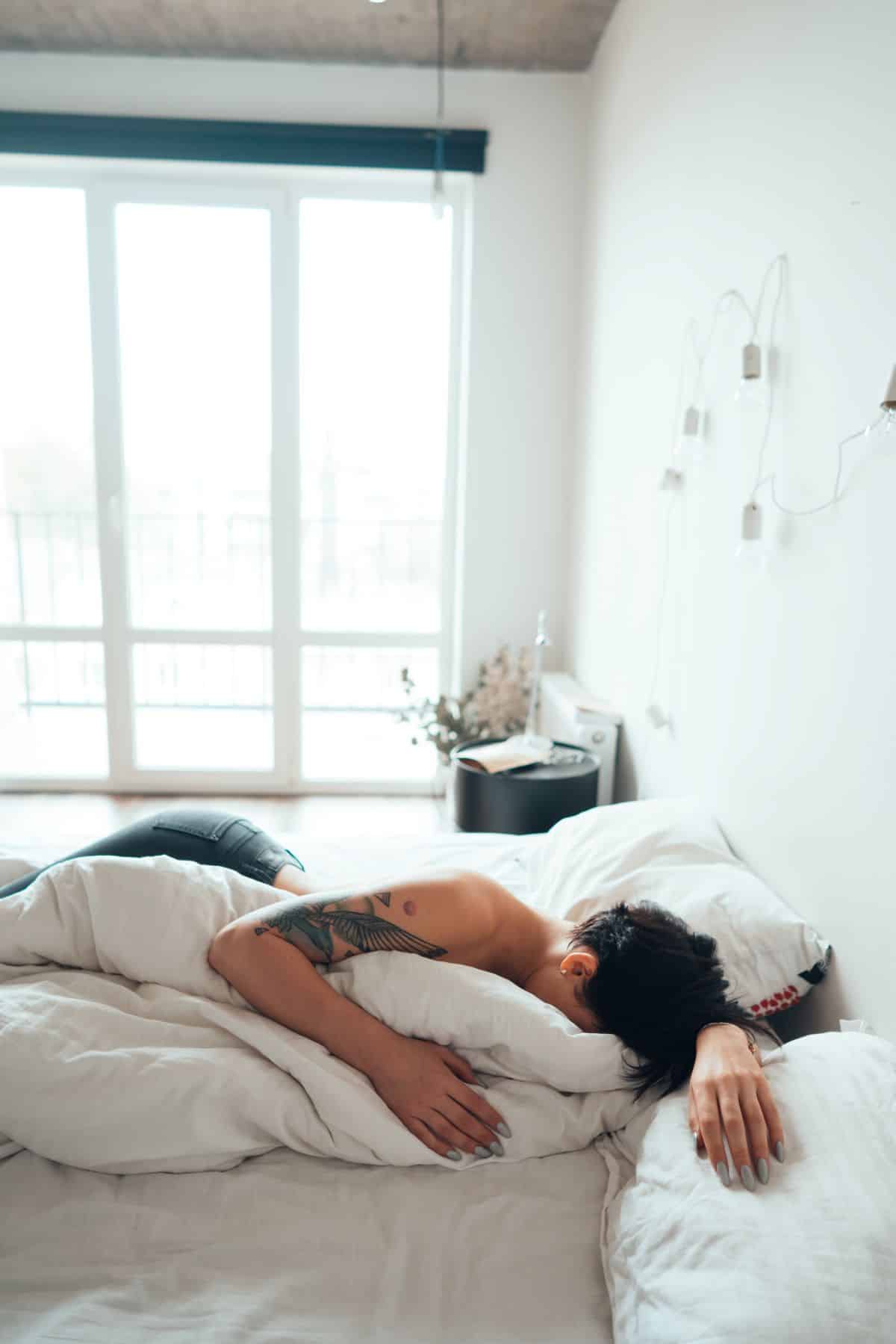 bare-girl-hot-and sweaty-while-sleeping-face-down-on-the-bed