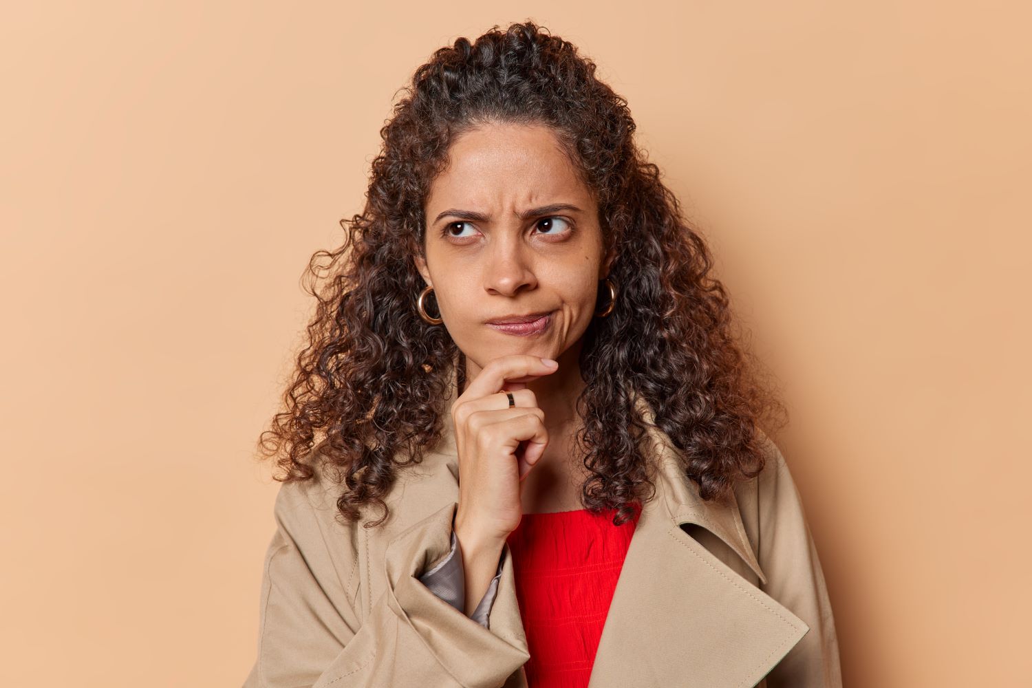Unsure afro-american woman with pursed lips